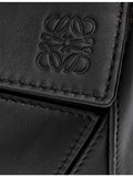 Loewe leather cross-body bag with woven handle (British brand)