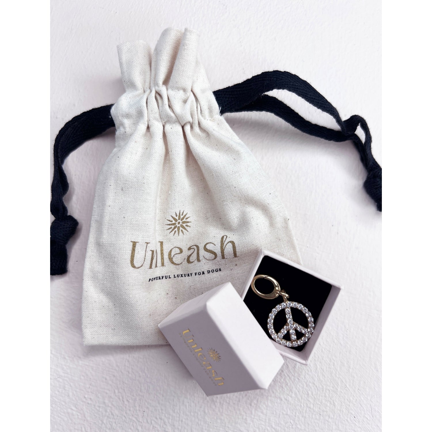 Unleash Cph peace sign brass zircon dog charm, imported from the UK