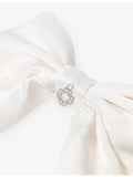 Maje charm-embellished silk bow barrette, imported from the UK