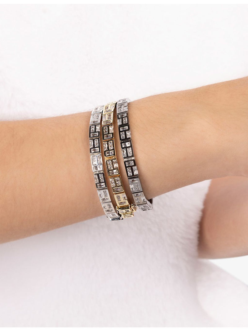 APM Monaco yellow-gold plated cubic zirconia bracelet, imported from the UK