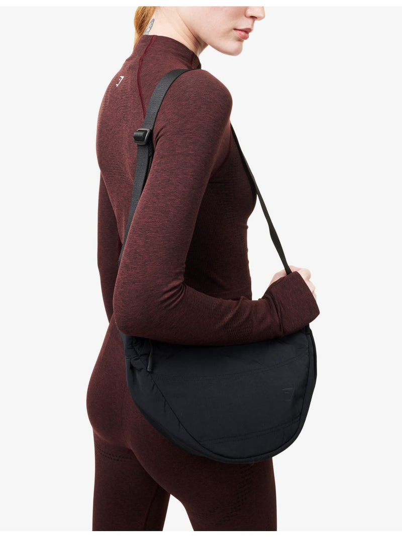 Gymshark Pleat nylon crossbody bag with adjustable strap, UK version