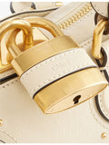 Chloé small leather top-handle bag with padlock charm, UK version