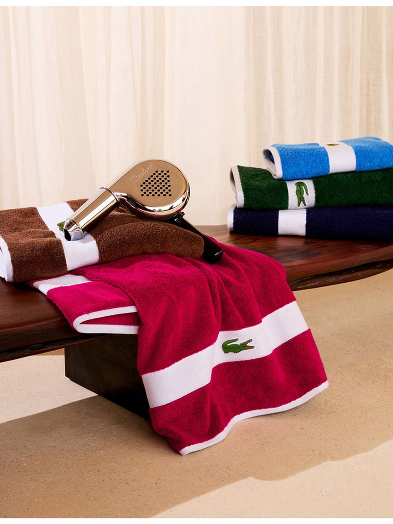 Lacoste cotton towel with woven stripe and crocodile logo - British product