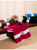 Lacoste cotton towel with woven stripe and crocodile logo - British product