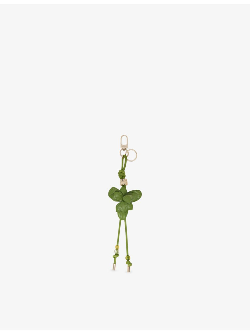 Maje leather bag charm with flower design and gold hardware (British brand)