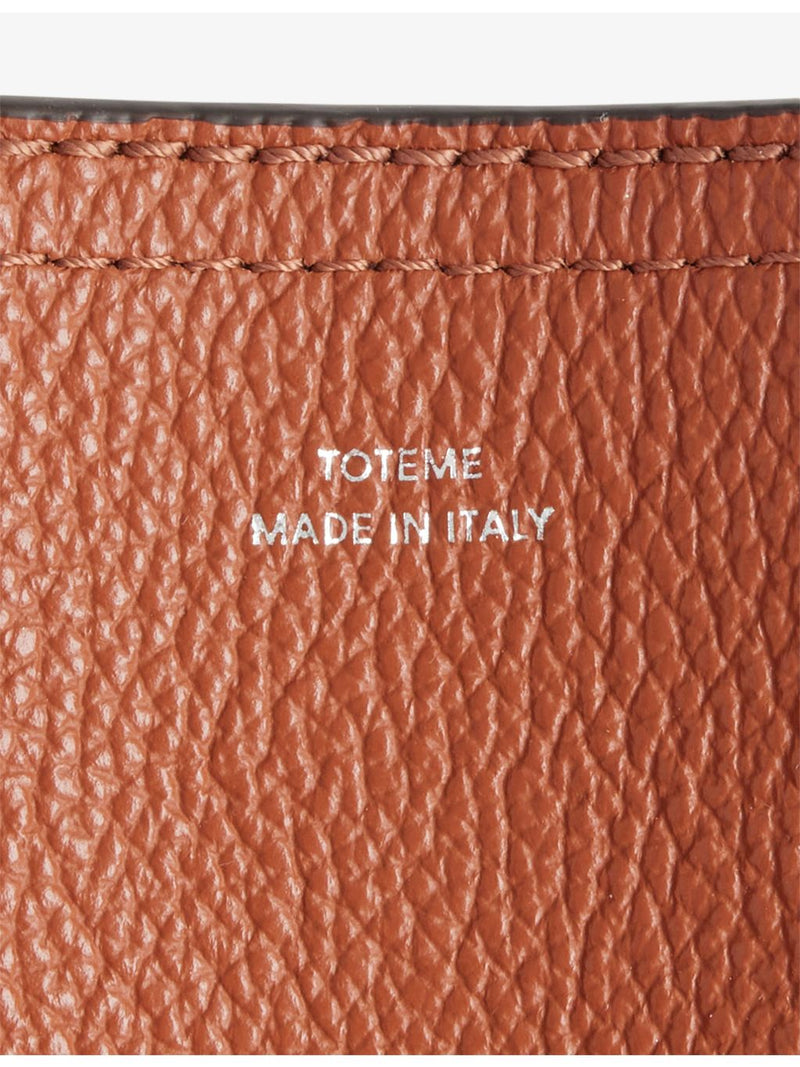 Totême belted leather tote bag with handles, imported from the UK