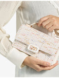 Dune woven top-handle bag with metallic weave and rhinestone embellishments, UK version