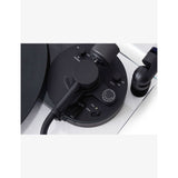 Transparent turntable record player with glass and aluminium design, UK version