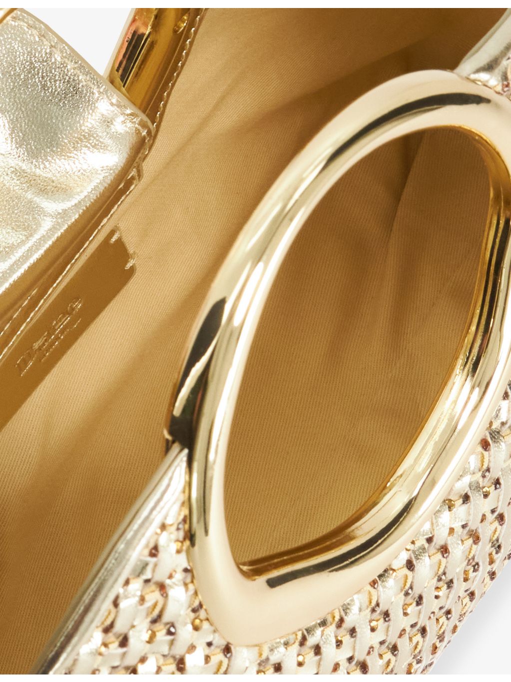 Dune metallic faux-leather clutch bag with cross-body strap, imported from the UK