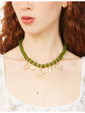 Meretrix beaded charm necklace with green beads and gold-tone starfish (British brand)