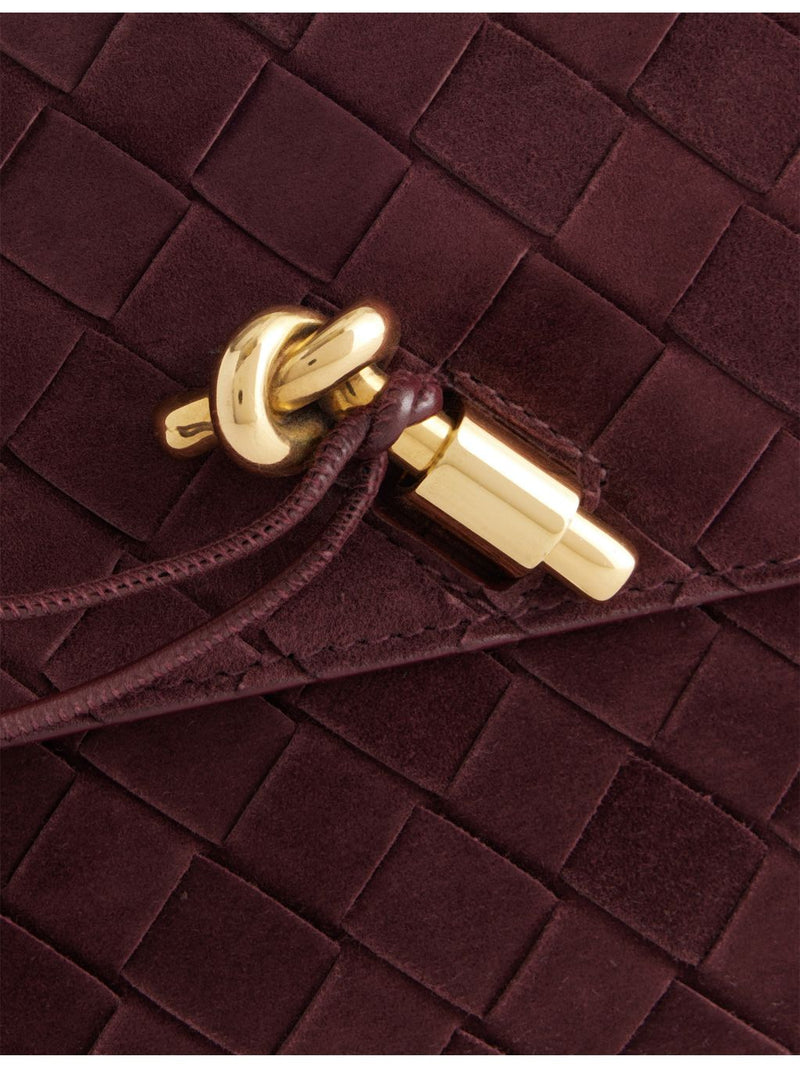Bottega Veneta suede clutch bag with Intrecciato weave (British brand)