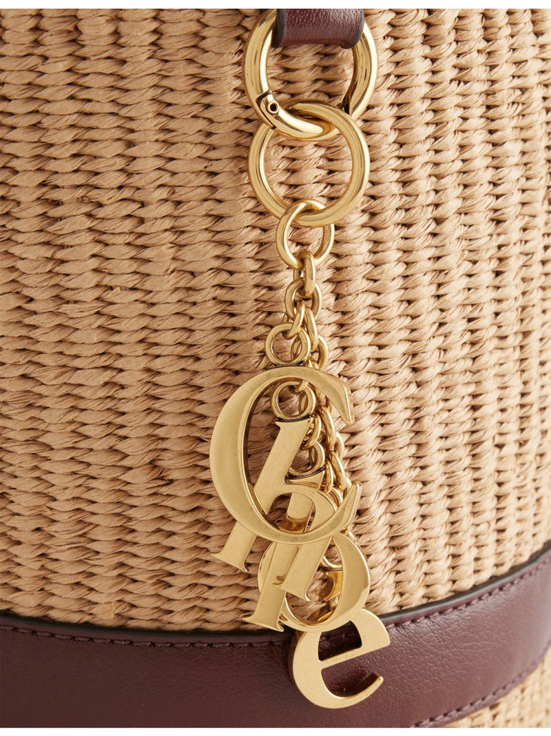 Chloé raffia bucket shoulder bag with charms, 16cm (British brand)