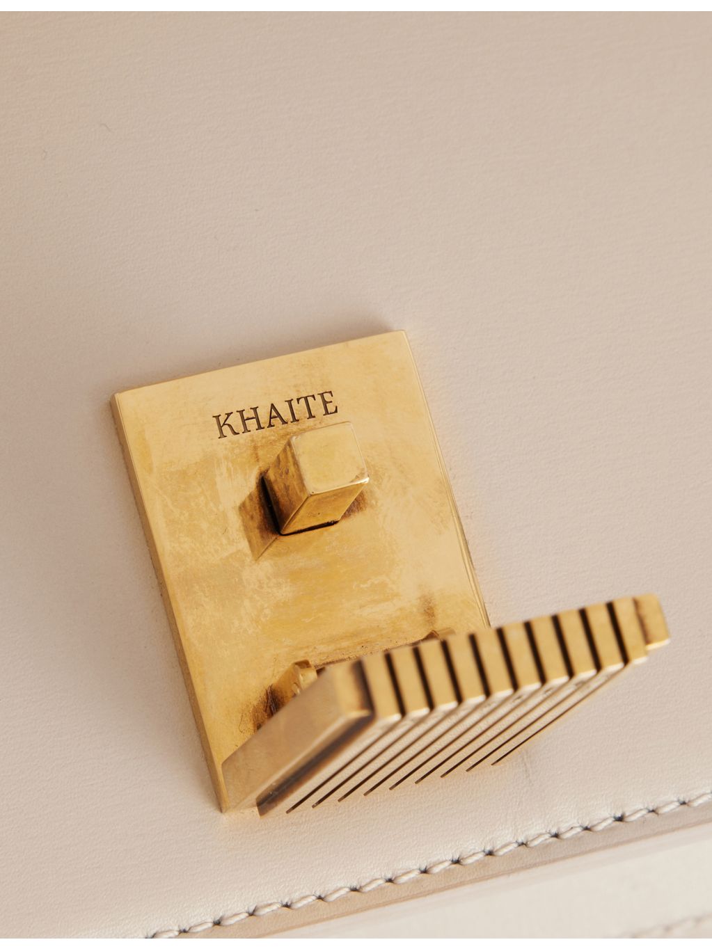 KHAITE Blake leather clutch with front hardware clasp (British brand)