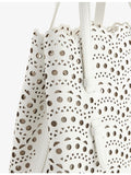 Alaïa Mina 20 laser-cut leather handbag - British product