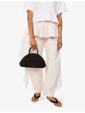 Alaïa small suede top-handle bag with curved shape, UK version
