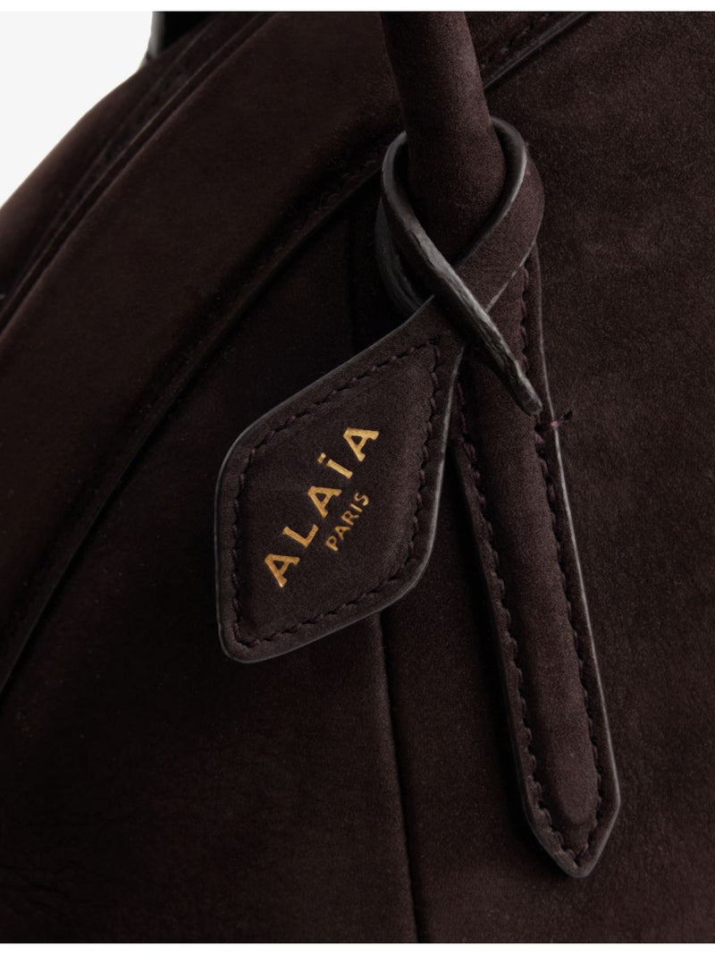 Alaïa small suede top-handle bag with curved shape, UK version