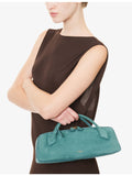 Alaïa suede clutch bag with gold-toned hardware, imported from the UK