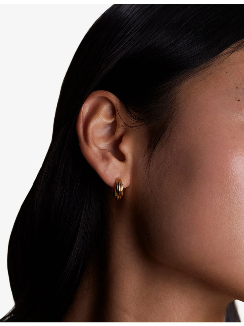 Astrid & Miyu 18ct gold-plated brass huggie hoop earrings, imported from the UK