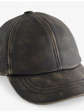 Distressed leather cap with curved peak, imported from the UK