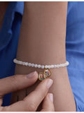 Astley Clarke mother of pearl locket bracelet gold-plated, UK version