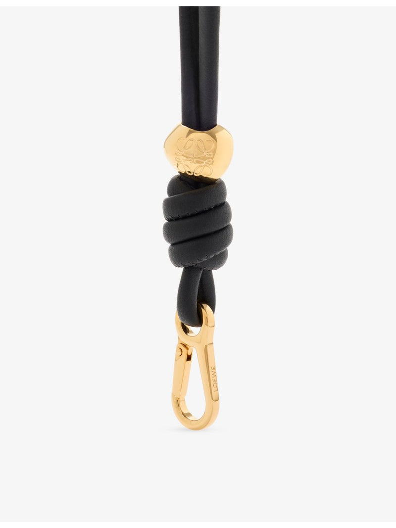 Loewe leather wristlet strap with knotted design and gold hardware, UK version