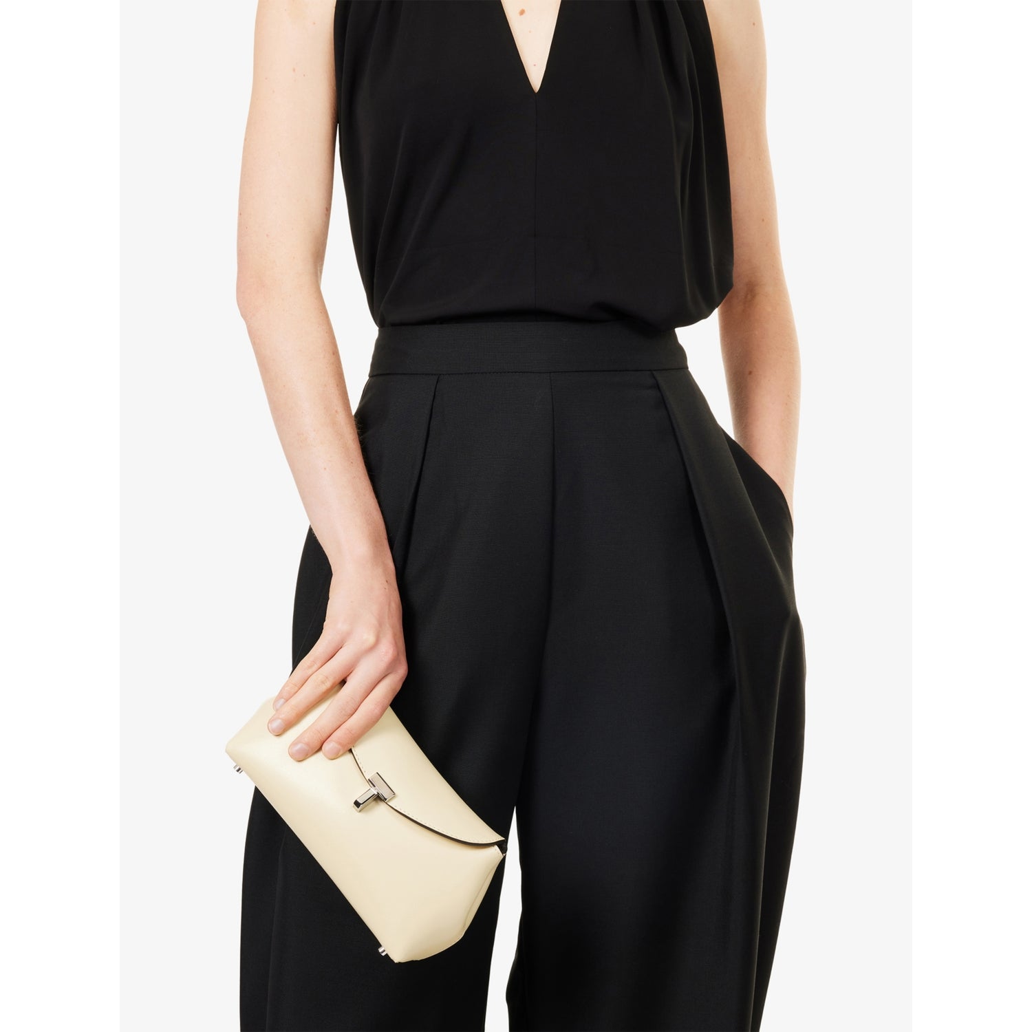 Totême mini T-Lock leather clutch bag, imported from the UK