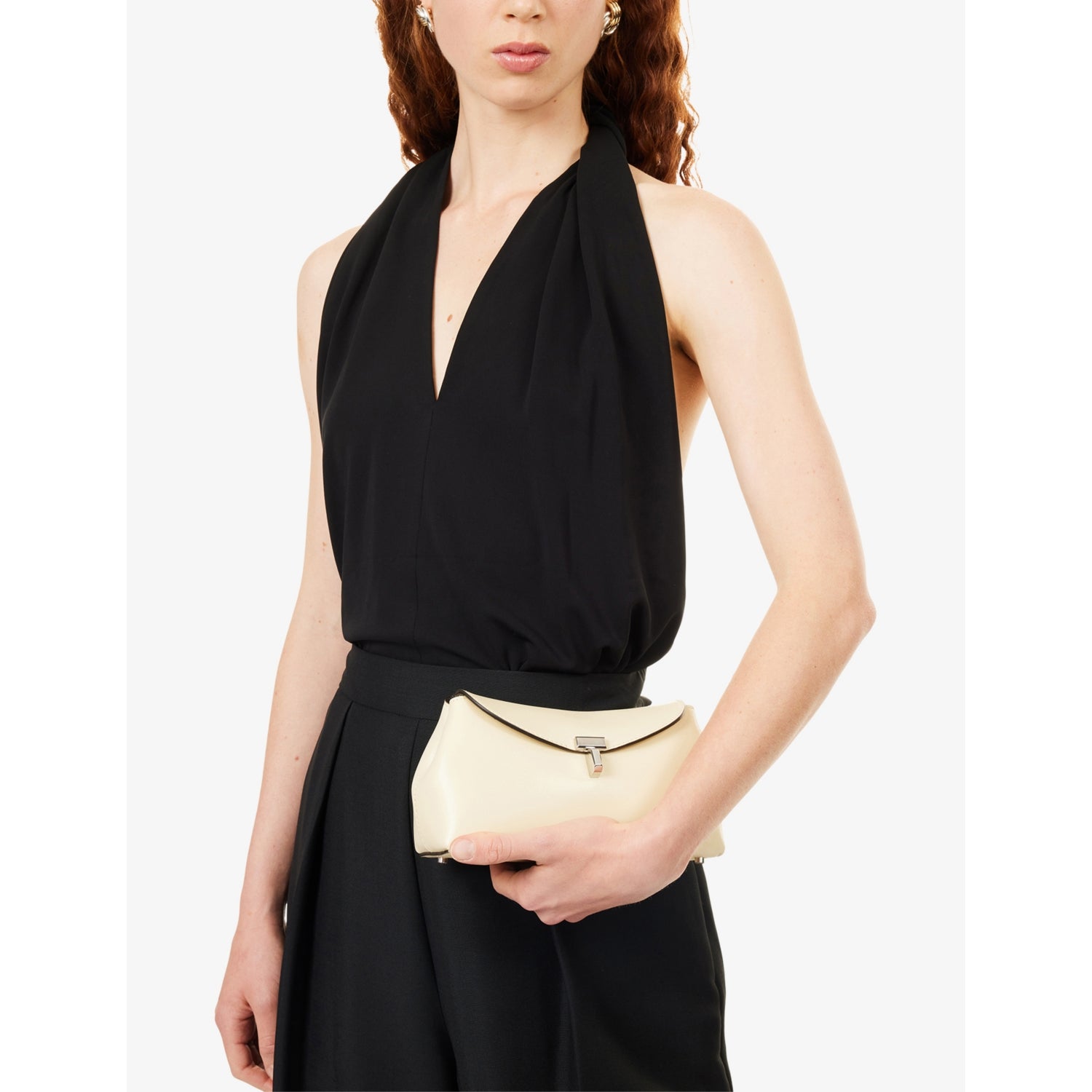 Totême mini T-Lock leather clutch bag, imported from the UK