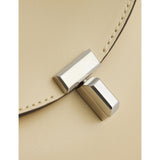 Totême mini T-Lock leather clutch bag, imported from the UK