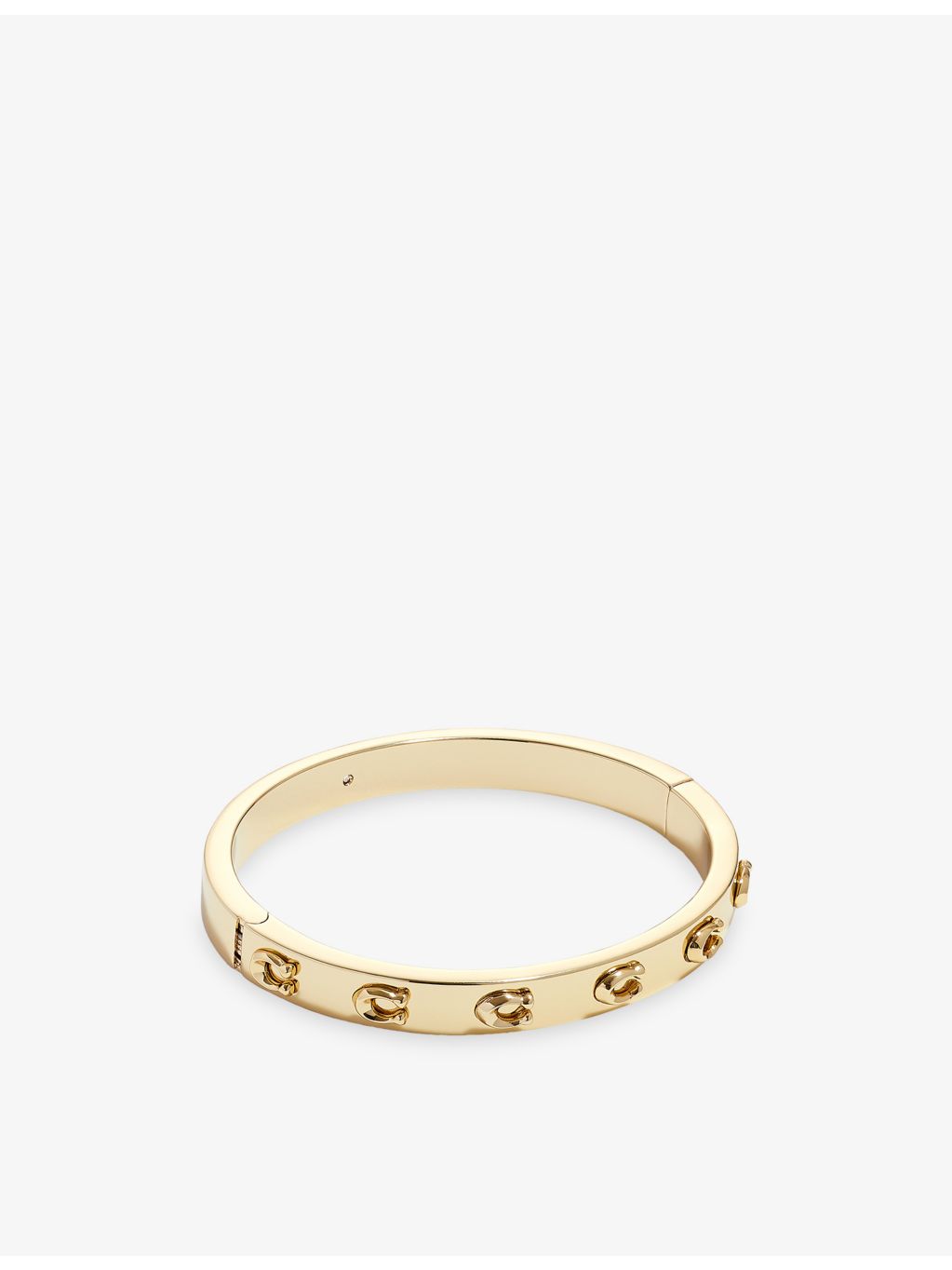 Coach gold-plated brass bracelet with sculpted C logo, imported from the UK