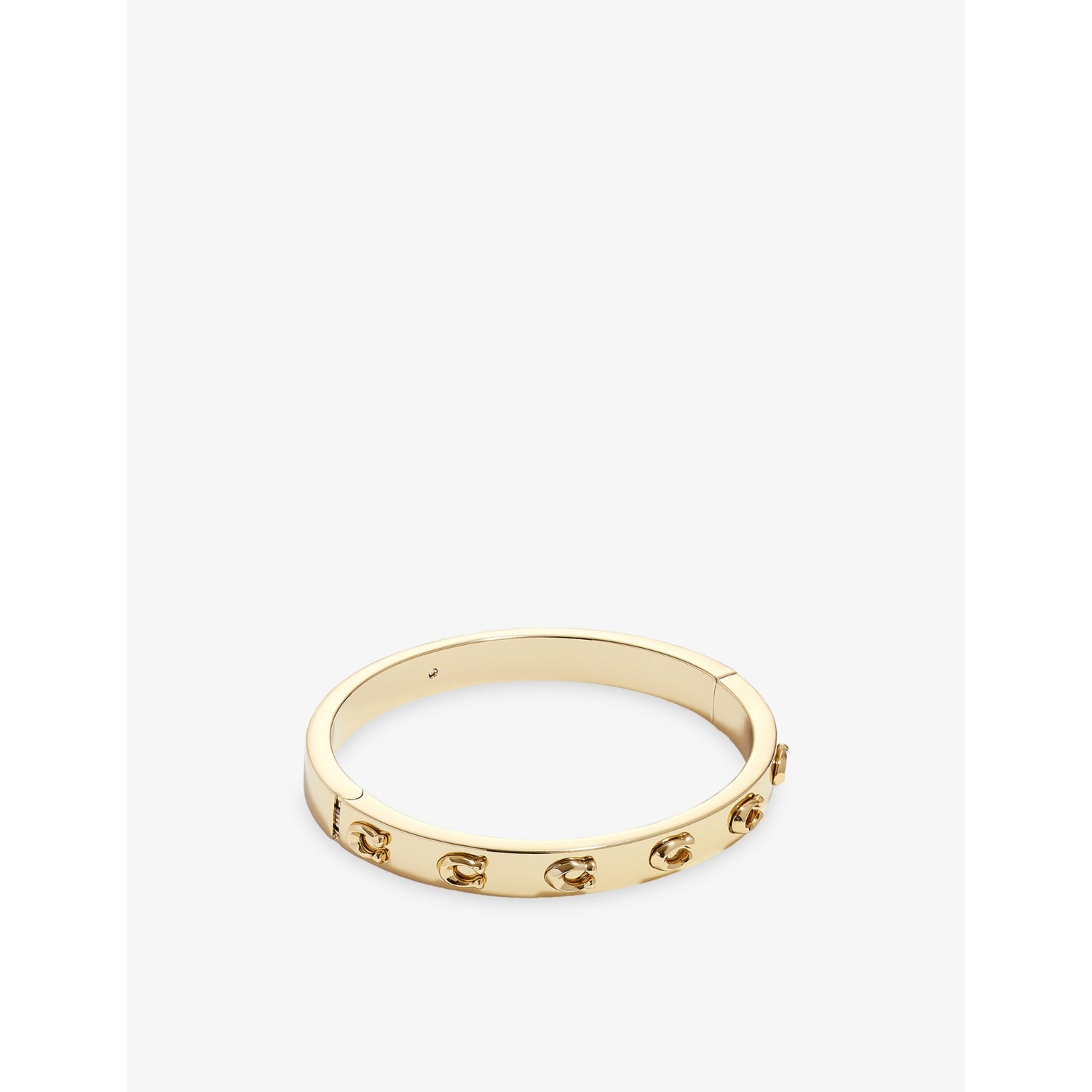 Coach gold-plated brass bracelet with sculpted C logo, imported from the UK