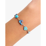 Poubel sterling silver charm bracelet with sea-inspired charms, imported from the UK