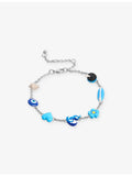Poubel sterling silver charm bracelet with sea-inspired charms, imported from the UK