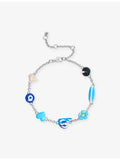 Poubel sterling silver charm bracelet with sea-inspired charms, imported from the UK