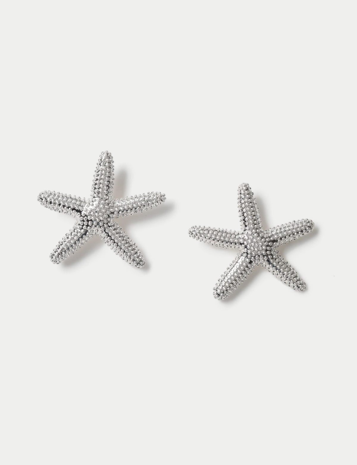 Rhodium oversized starfish stud earrings, imported from the UK