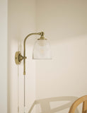 Ribbed plug in wall light with antique brass finish, imported from the UK