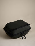Rubberised travel tech organiser with compartments and secure zip fastenings, UK version