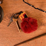 Material: Acrylic, Plastic. Height: 6cm. Width: 4.5cm. Design: Gryffindor, Motif, Pom Pom. 100% Officially Licensed. Fastening: Clip.