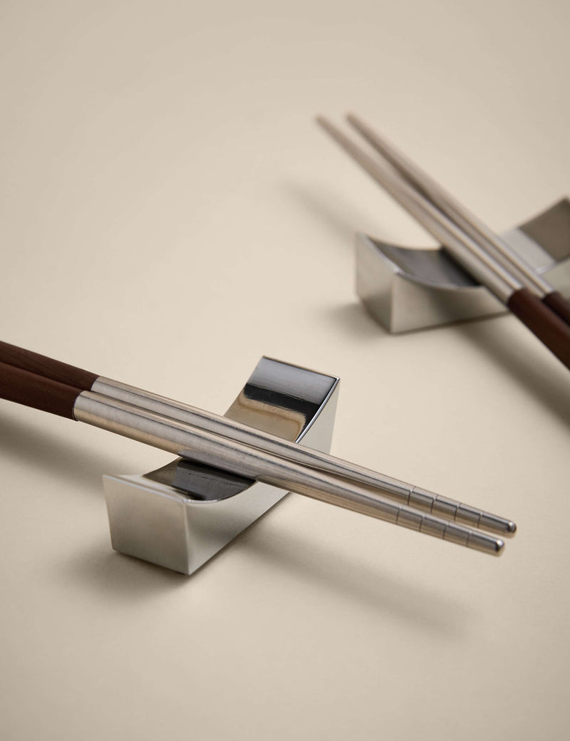 Set of two chopsticks with rests in metal and wood, UK version