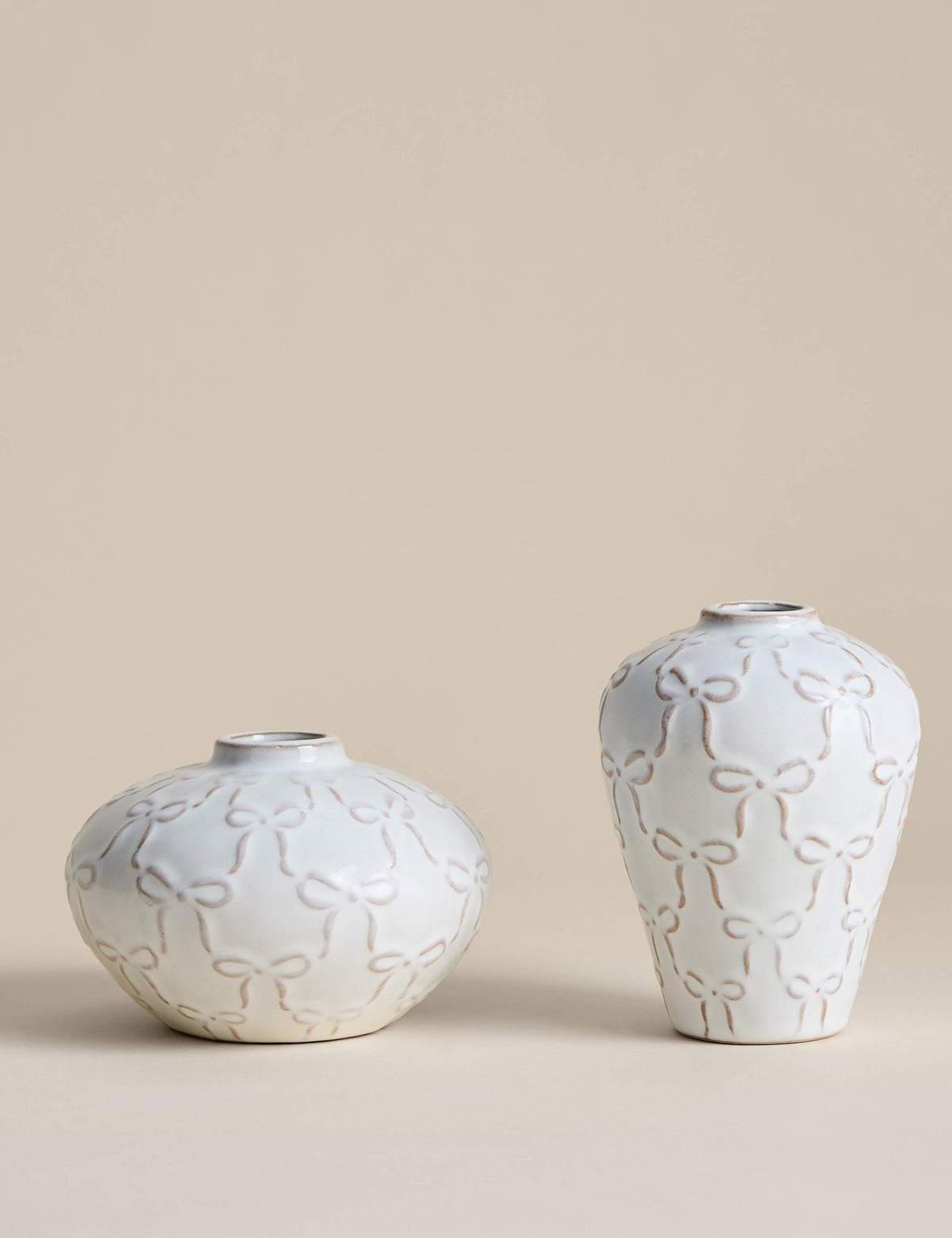 Set of two mini ceramic bow vases, imported from the UK