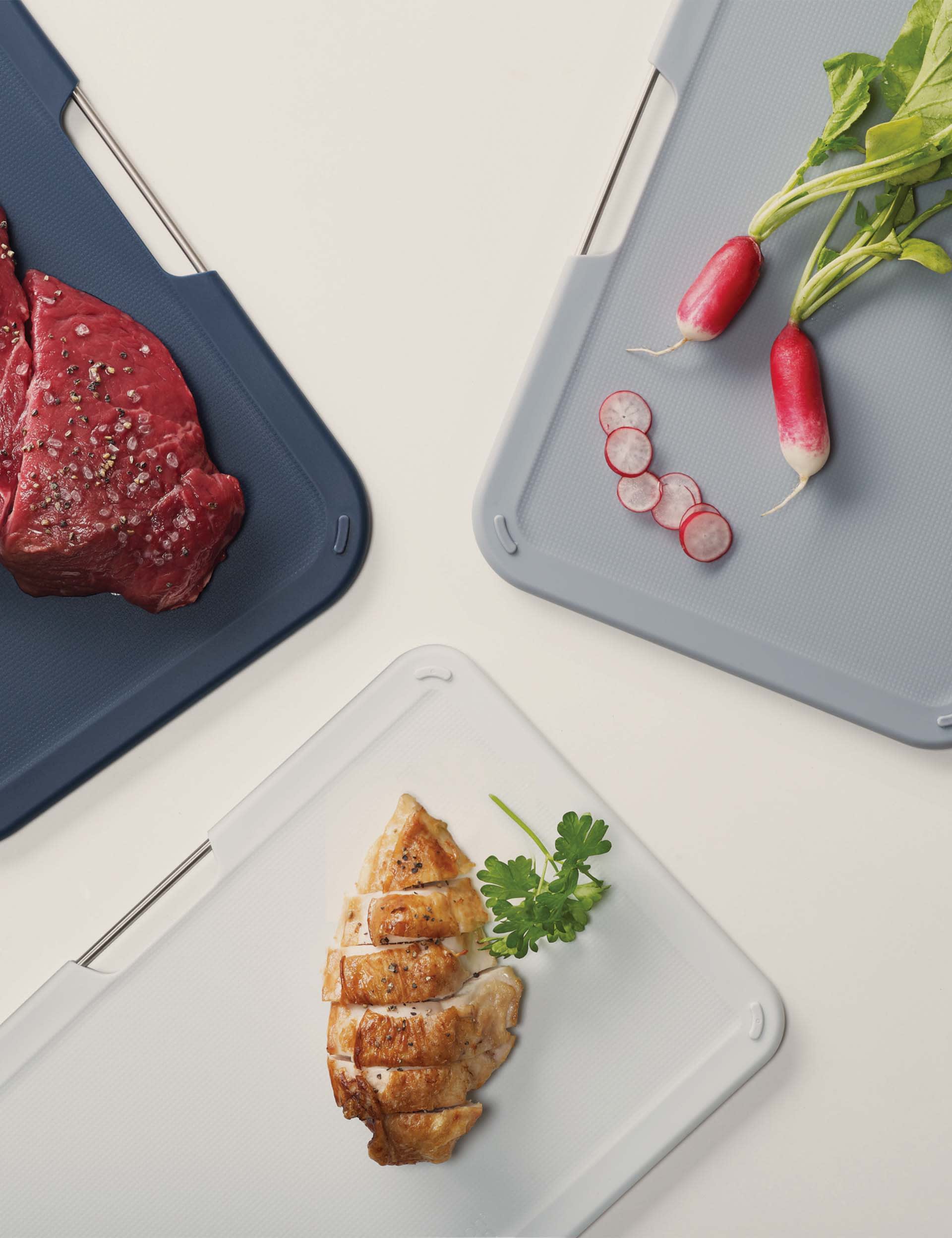 Joseph Joseph set of 3 plastic chopping boards with storage stand (British brand)