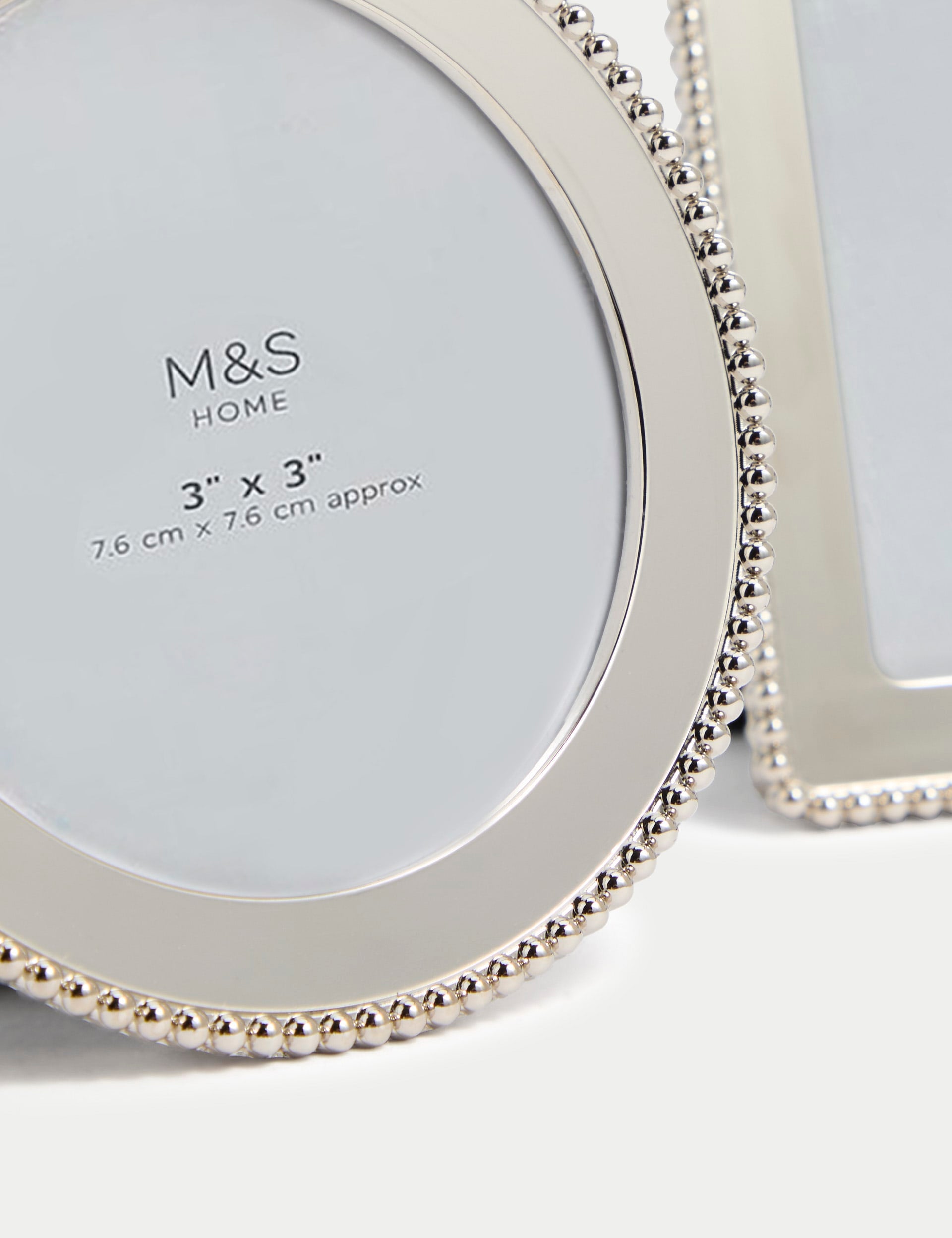 Set of three silver photo frames with square, rectangular, and circular shapes (British brand)