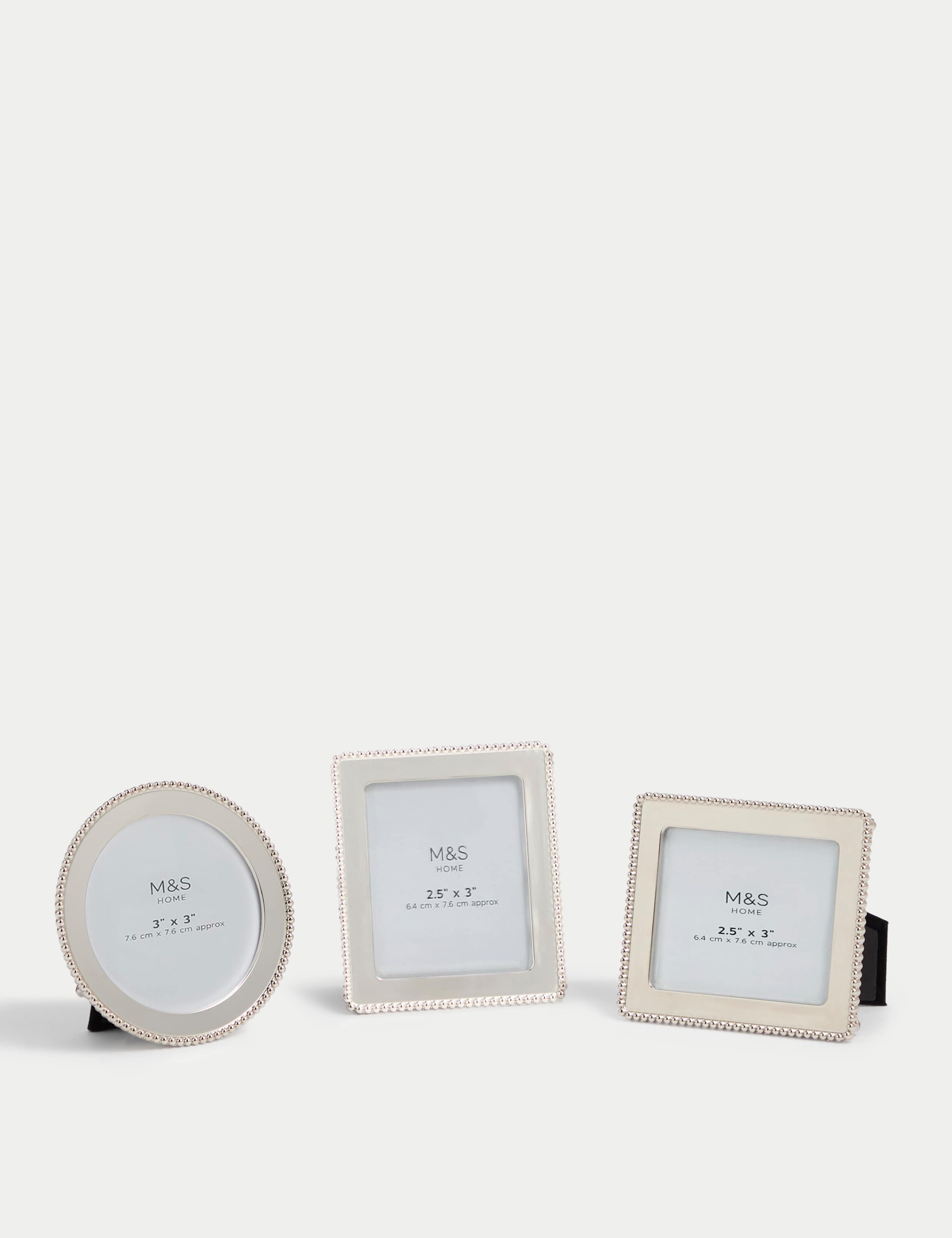 Set of three silver photo frames with square, rectangular, and circular shapes (British brand)