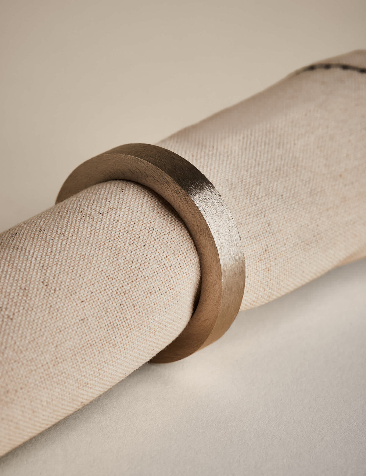 Set of four metallic napkin rings (British brand)