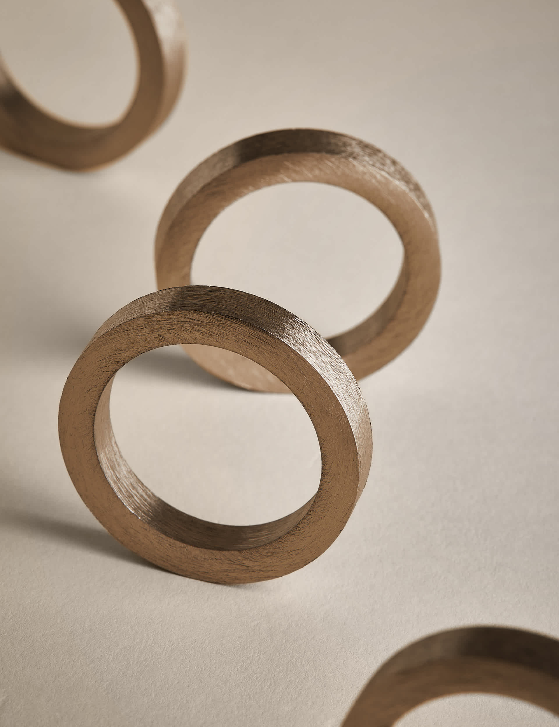 Set of four metallic napkin rings (British brand)