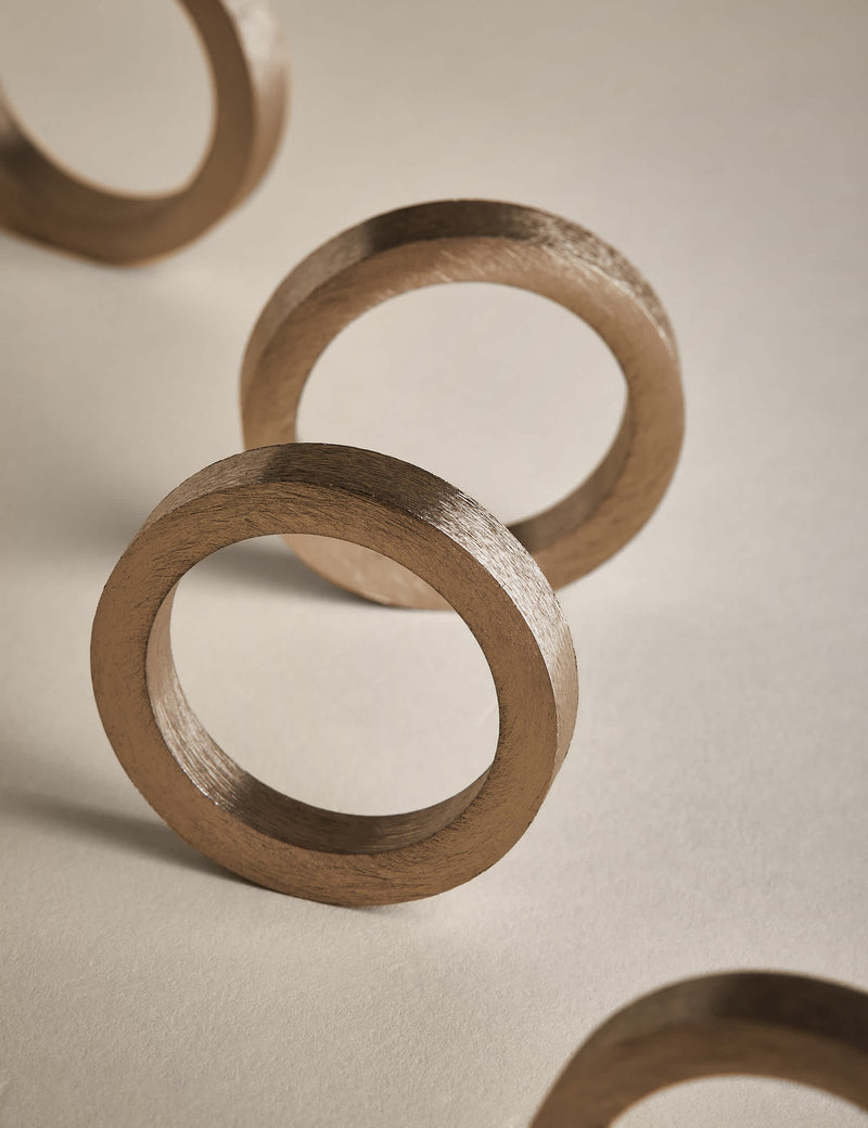 Set of four metallic napkin rings (British brand)