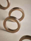 Set of four metallic napkin rings (British brand)