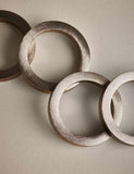 Set of four metallic napkin rings (British brand)