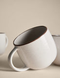 Set of four speckled ceramic mugs with contrast rims - British product