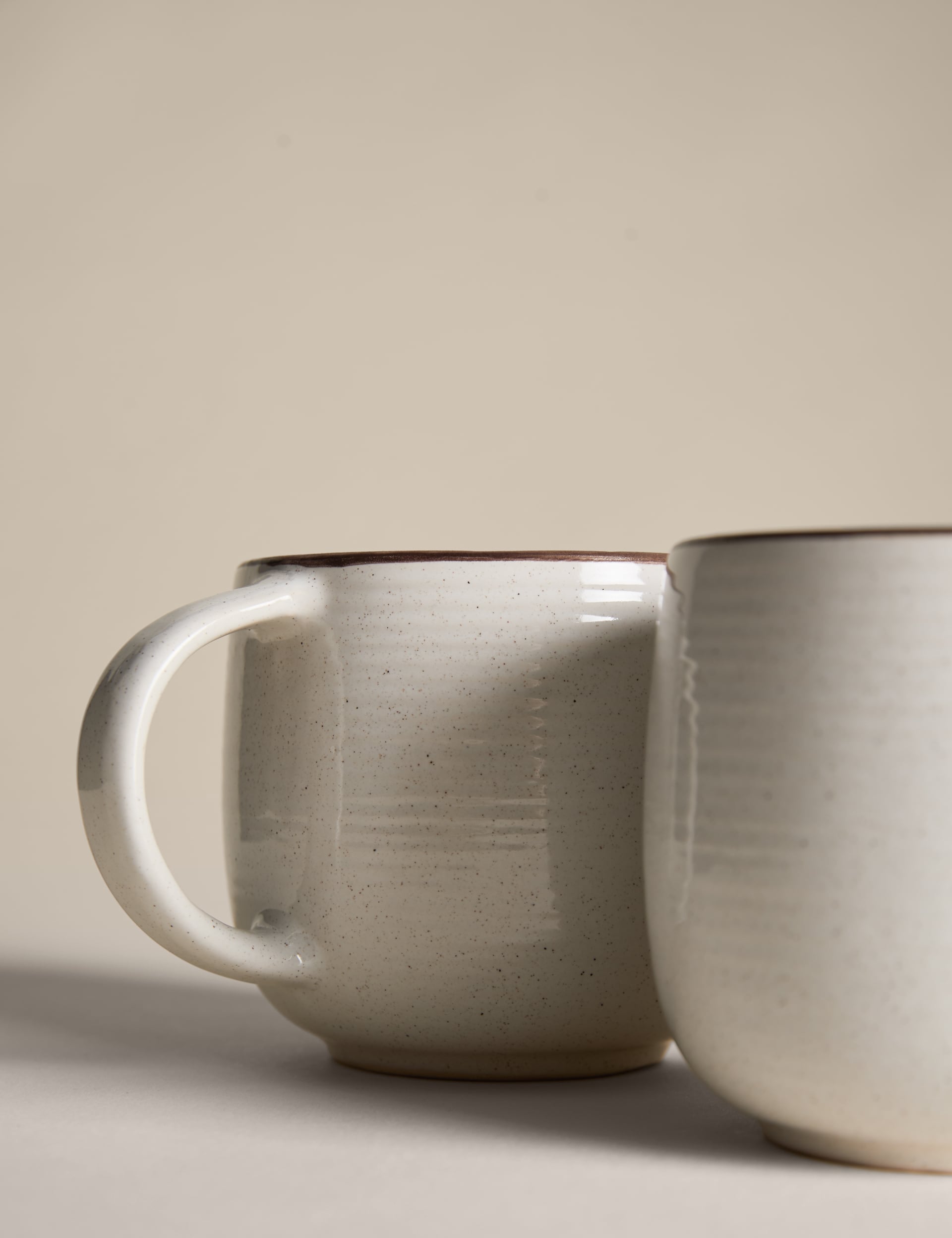 Set of four speckled ceramic mugs with contrast rims - British product