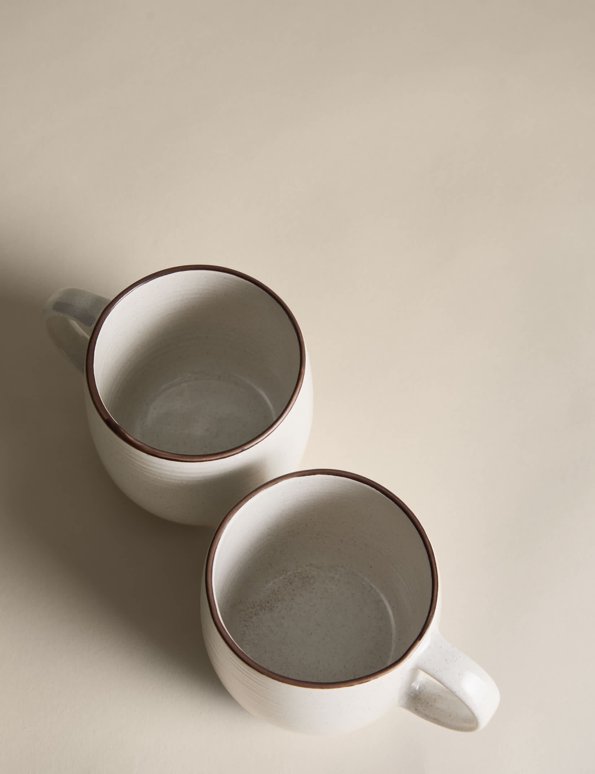 Set of four speckled ceramic mugs with contrast rims - British product